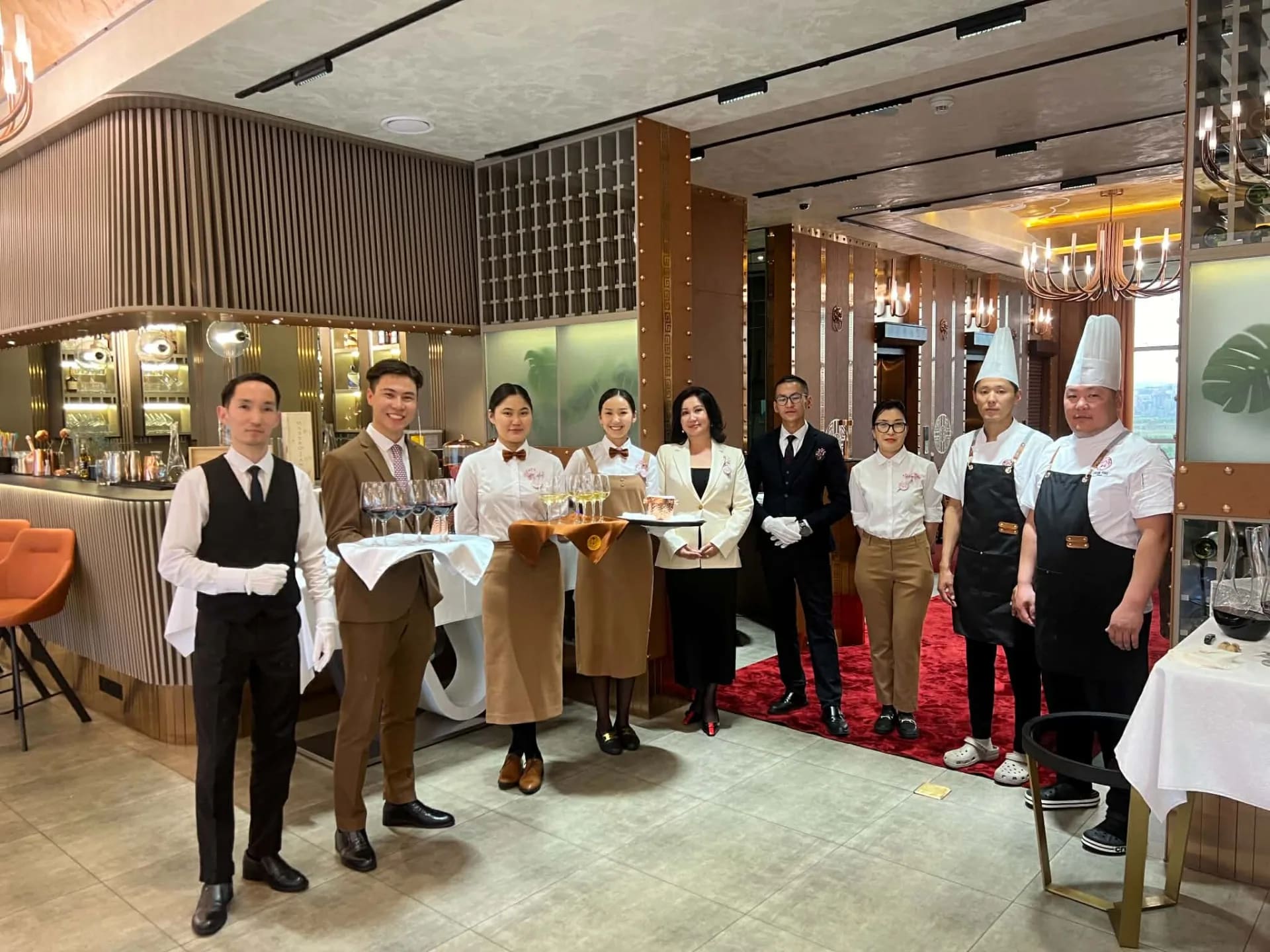 Choijin restaurant team standing together inside the dining room