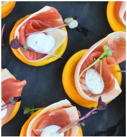 Prosciutto ham with goat cheese, olives from the Choijin finger food special set menu.