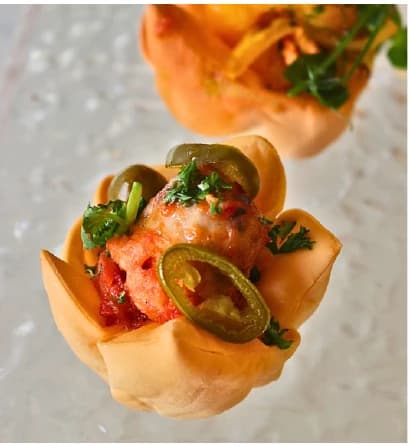 Sausage tomatoes sauce & jalapeno from the Choijin finger food special set menu.